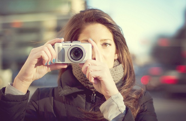 Woman Holding a Camera - Icon Photography School